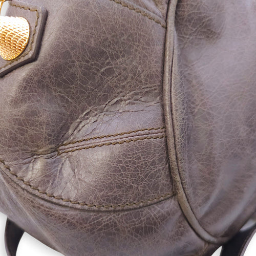 Pompon Large Dark brown Top Handle Bag in Distressed Leather, Gold hardware