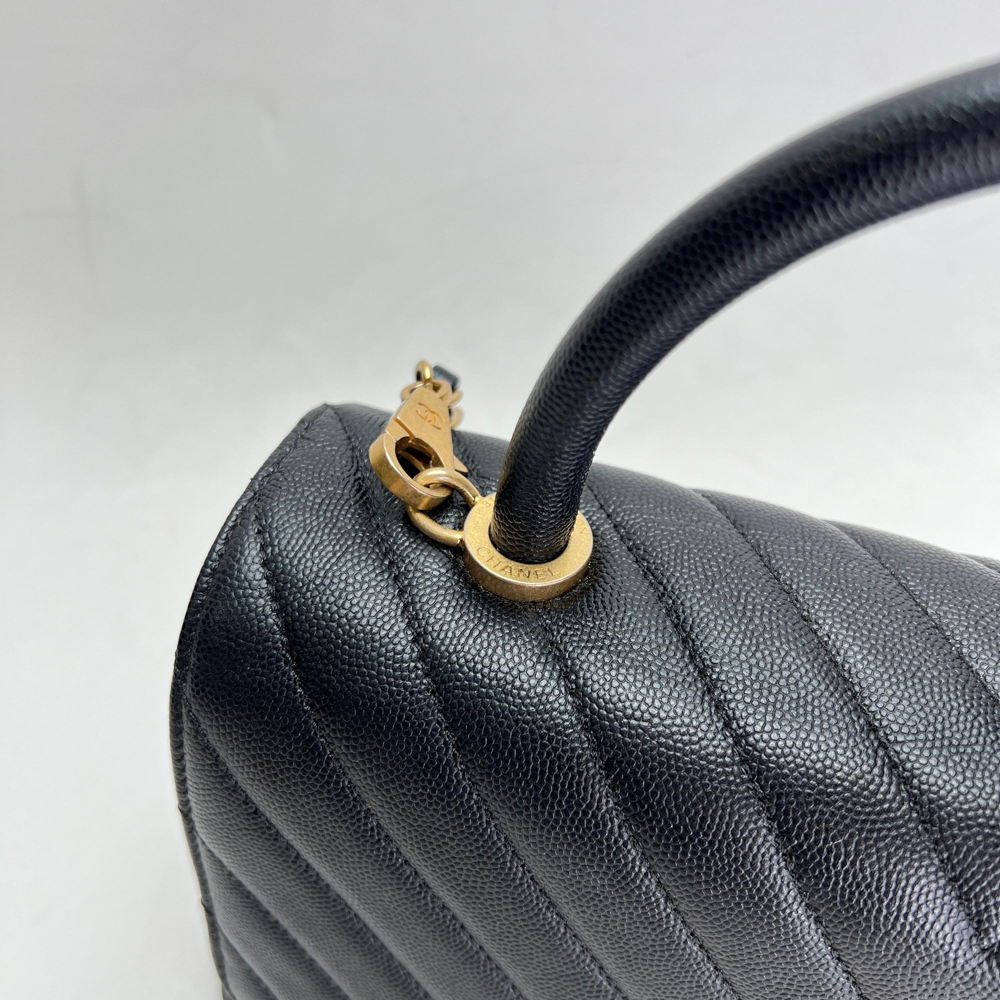 Coco Medium Black Top Handle Bag in Caviar Leather, Gold hardware