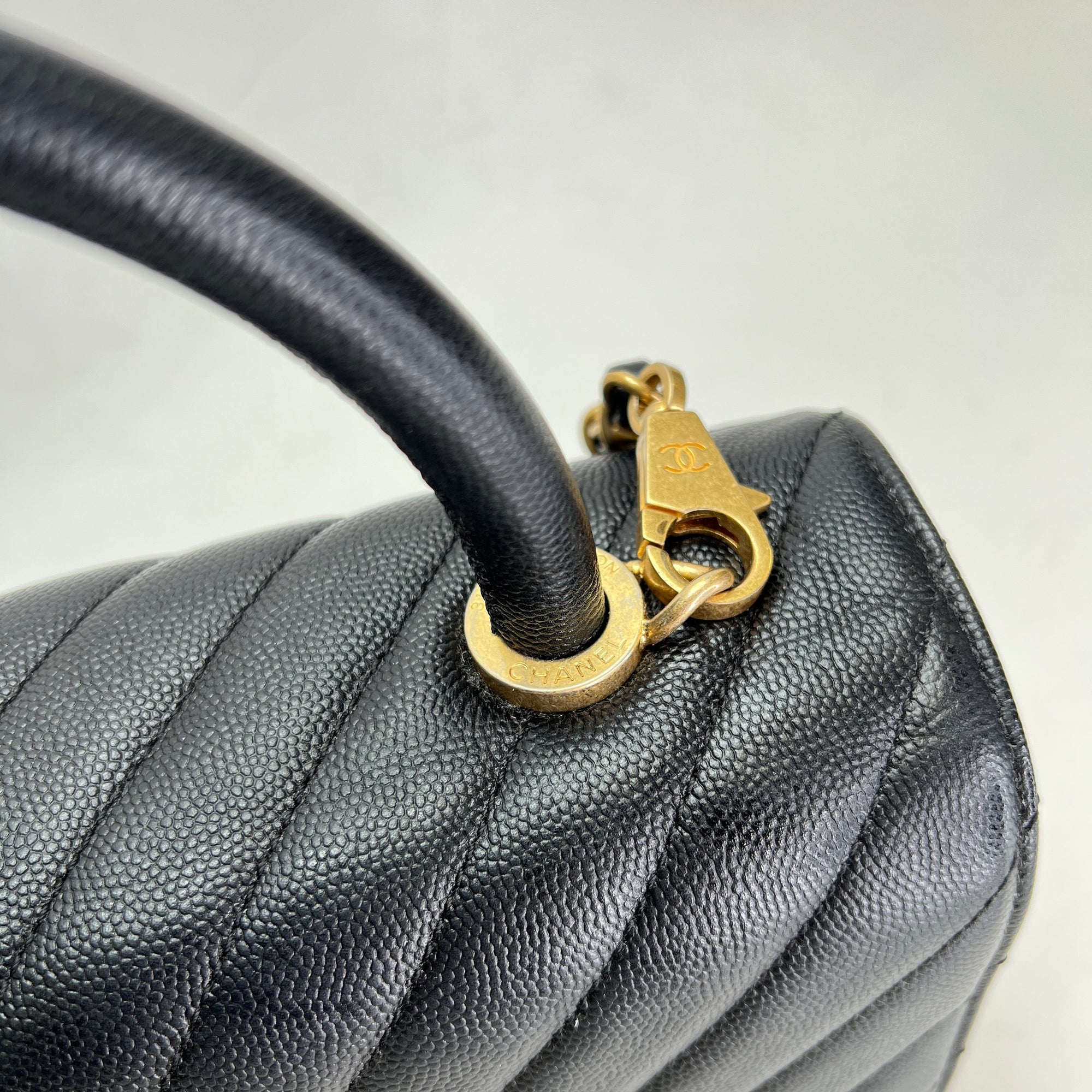 Coco Medium Black Top Handle Bag in Caviar Leather, Gold hardware