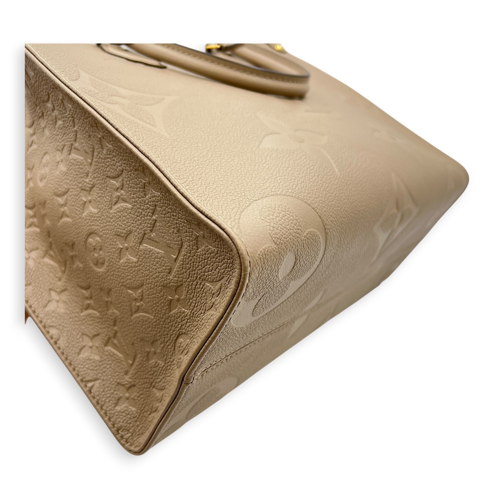 OnTheGo MM Beige Top Handle Bag in Empreinte Leather, Gold hardware