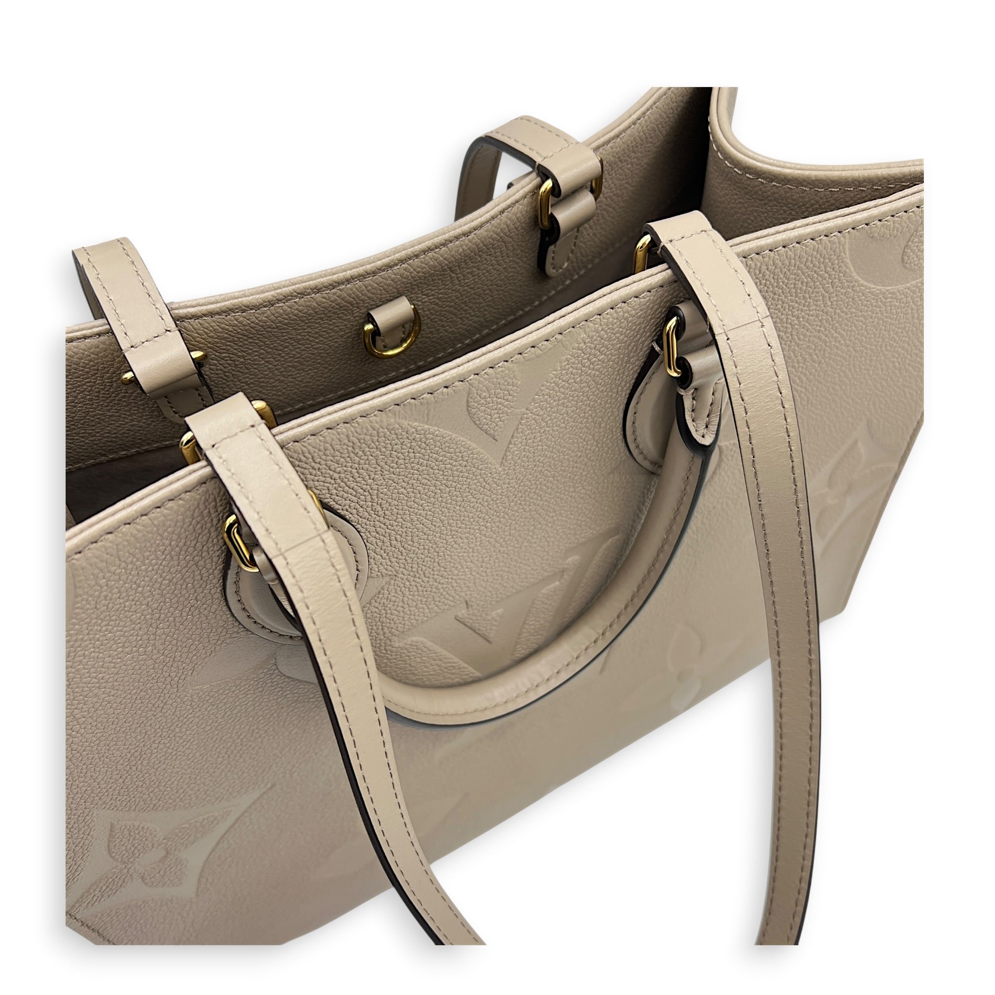 OnTheGo MM Beige Top Handle Bag in Empreinte Leather, Gold hardware