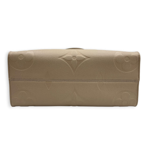 OnTheGo MM Beige Top Handle Bag in Empreinte Leather, Gold hardware