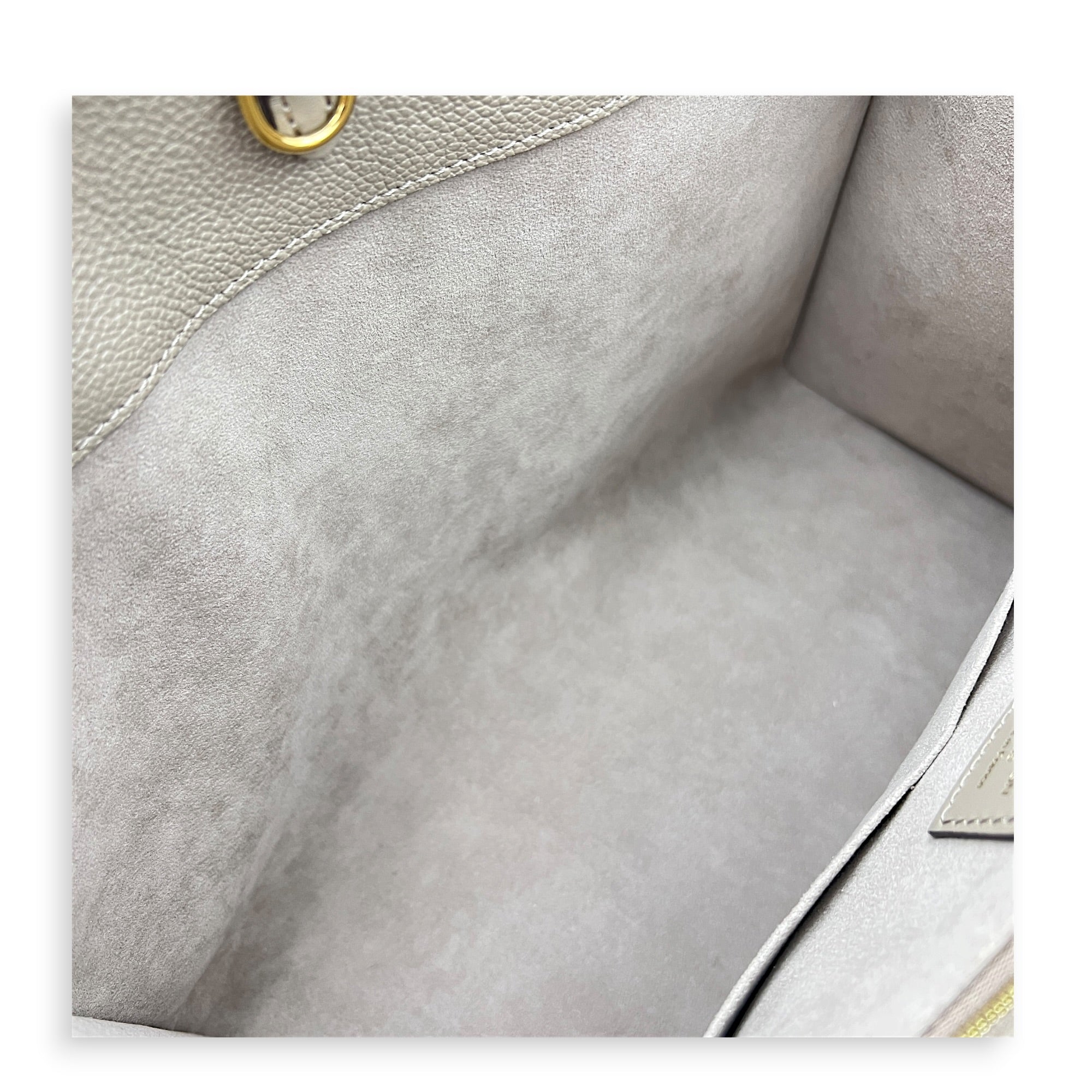 OnTheGo MM Beige Top Handle Bag in Empreinte Leather, Gold hardware
