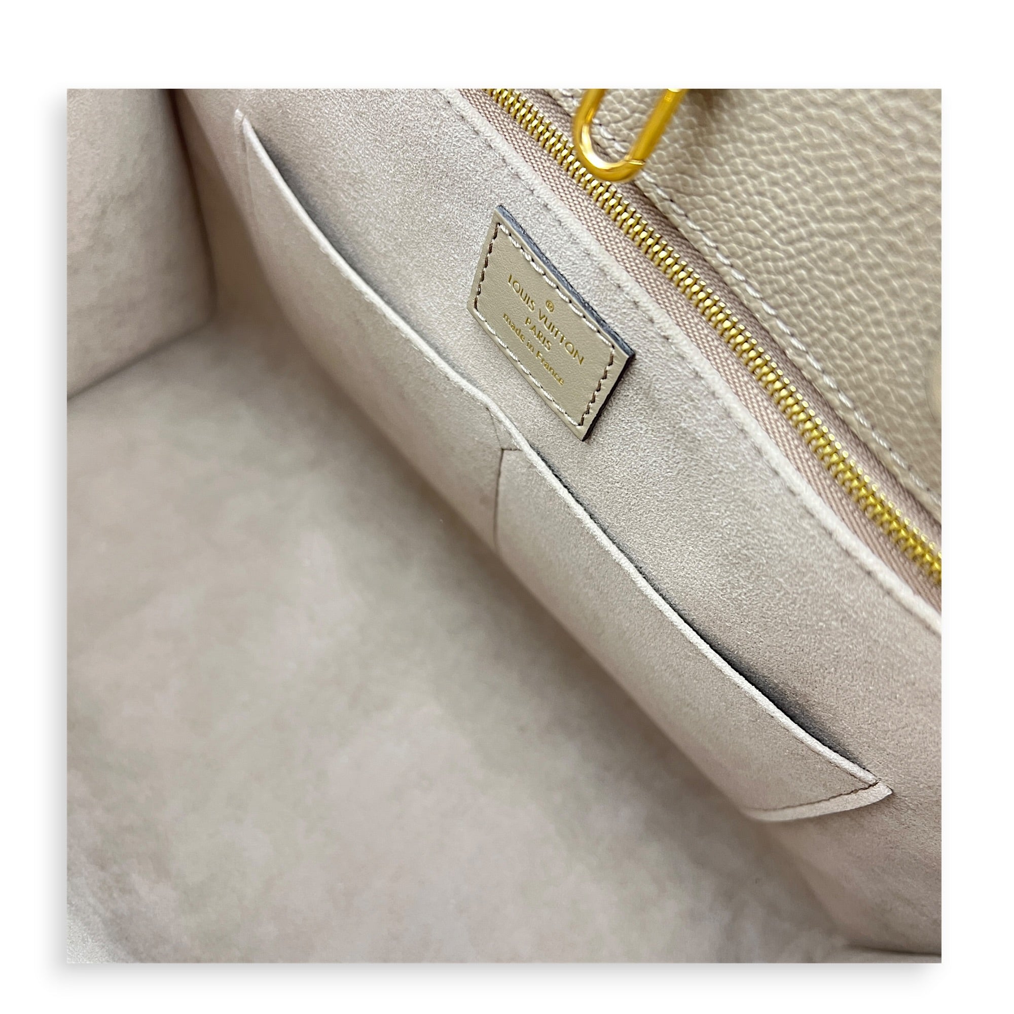 OnTheGo MM Beige Top Handle Bag in Empreinte Leather, Gold hardware