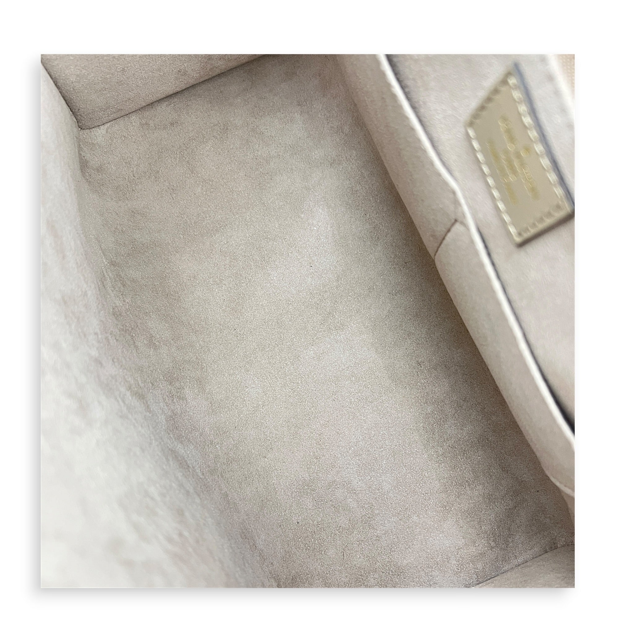 OnTheGo MM Beige Top Handle Bag in Empreinte Leather, Gold hardware