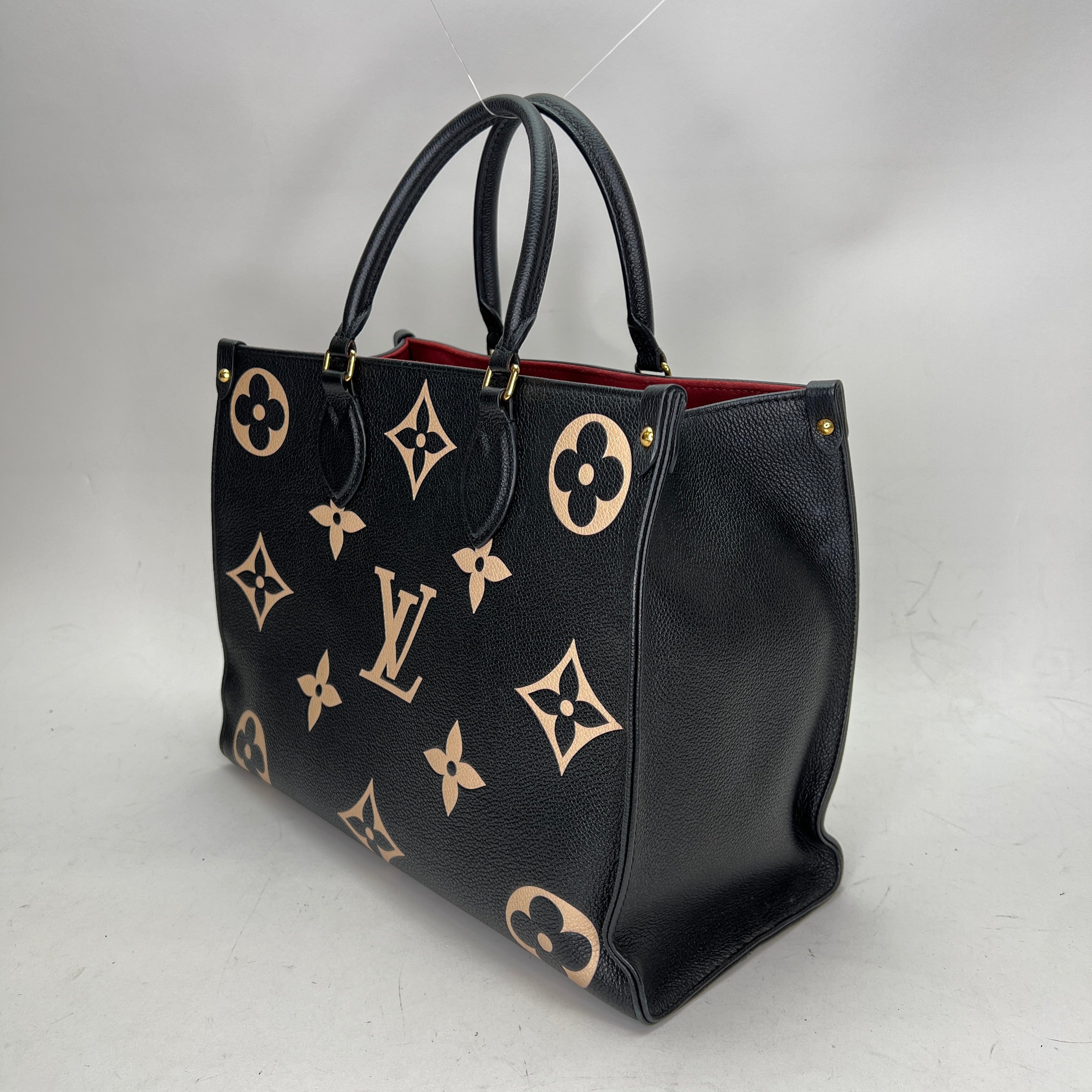 OnTheGo MM Black Tote Bag in Monogram Empreinte Leather Gold hardware