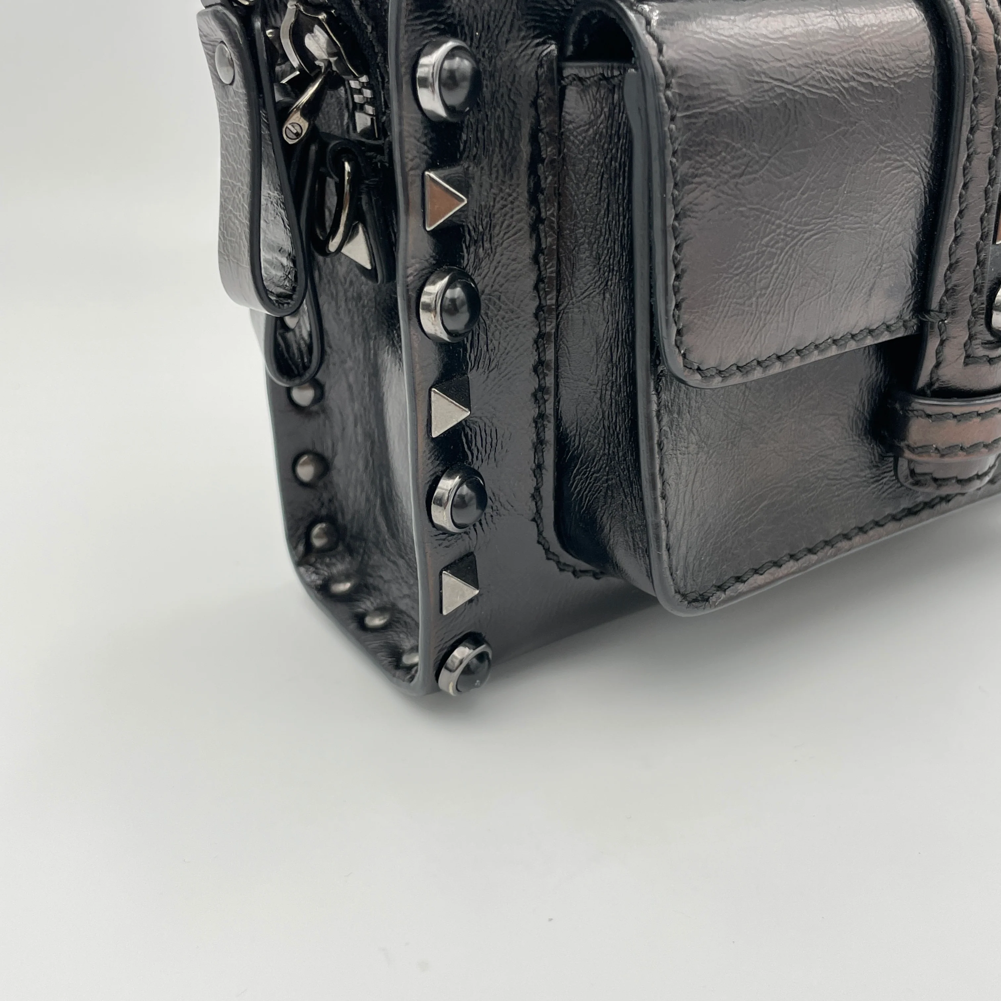 Rolling Rockstud Black Crossbody Bag in Calfskin, Gunmetal hardware