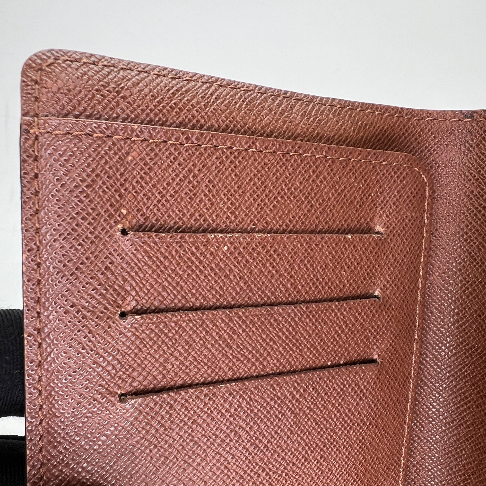 Bi Fold Brown Passport Holder in Monogram Coated Canvas