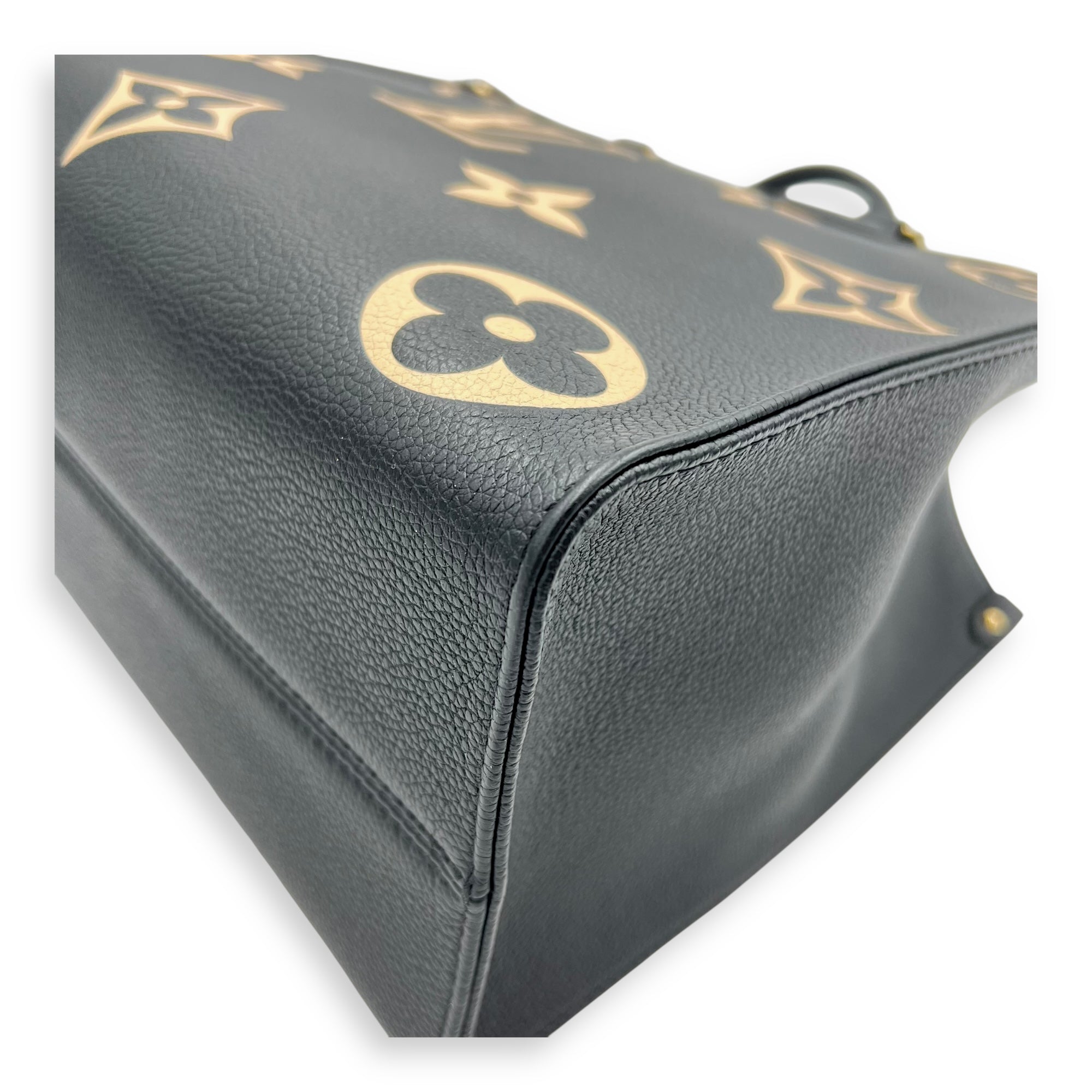 OnTheGo MM Blue Top Handle Bag in Empreinte Leather, Gold hardware