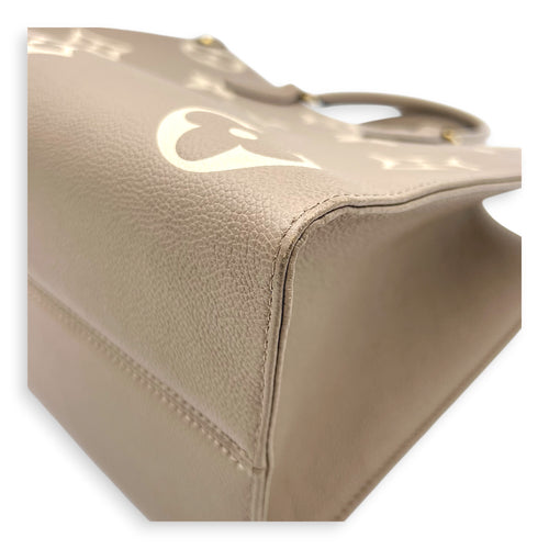 OnTheGo Top Handle Bag MM Beige in Empreinte Leather, Gold hardware