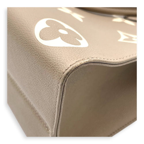 OnTheGo Top Handle Bag MM Beige in Empreinte Leather, Gold hardware