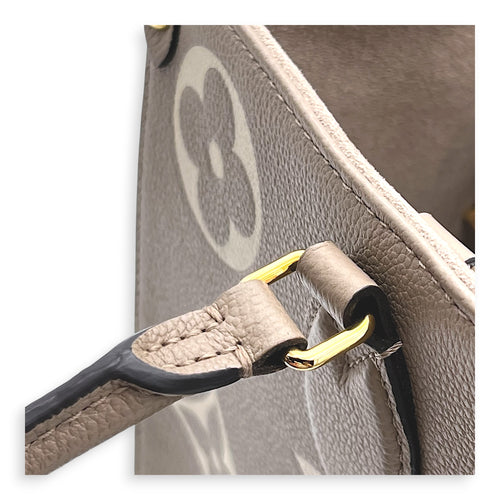 OnTheGo Top Handle Bag MM Beige in Empreinte Leather, Gold hardware