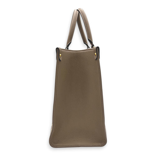 OnTheGo Top Handle Bag MM Beige in Empreinte Leather, Gold hardware