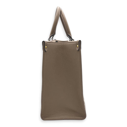OnTheGo Top Handle Bag MM Beige in Empreinte Leather, Gold hardware