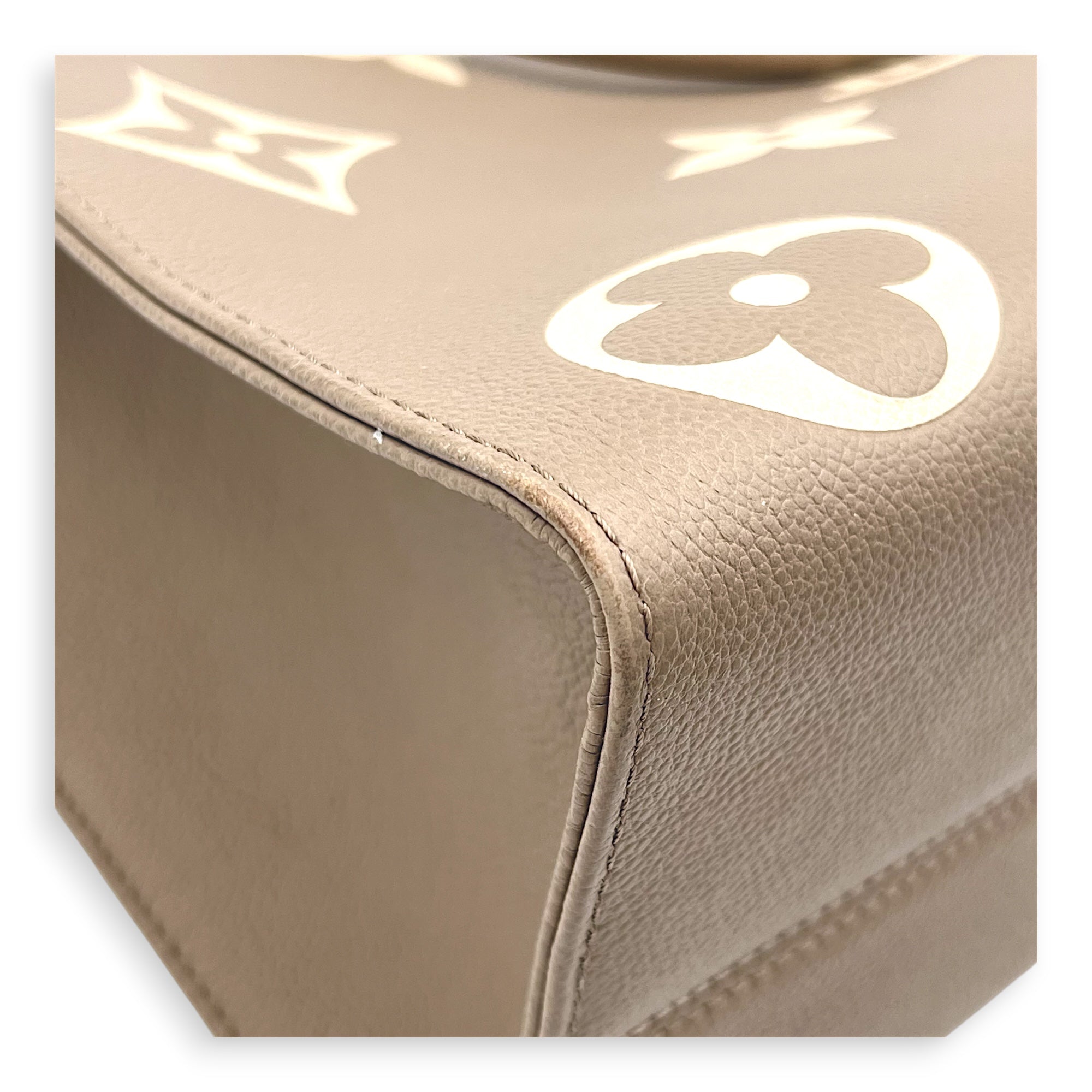 OnTheGo Top Handle Bag MM Beige in Empreinte Leather, Gold hardware