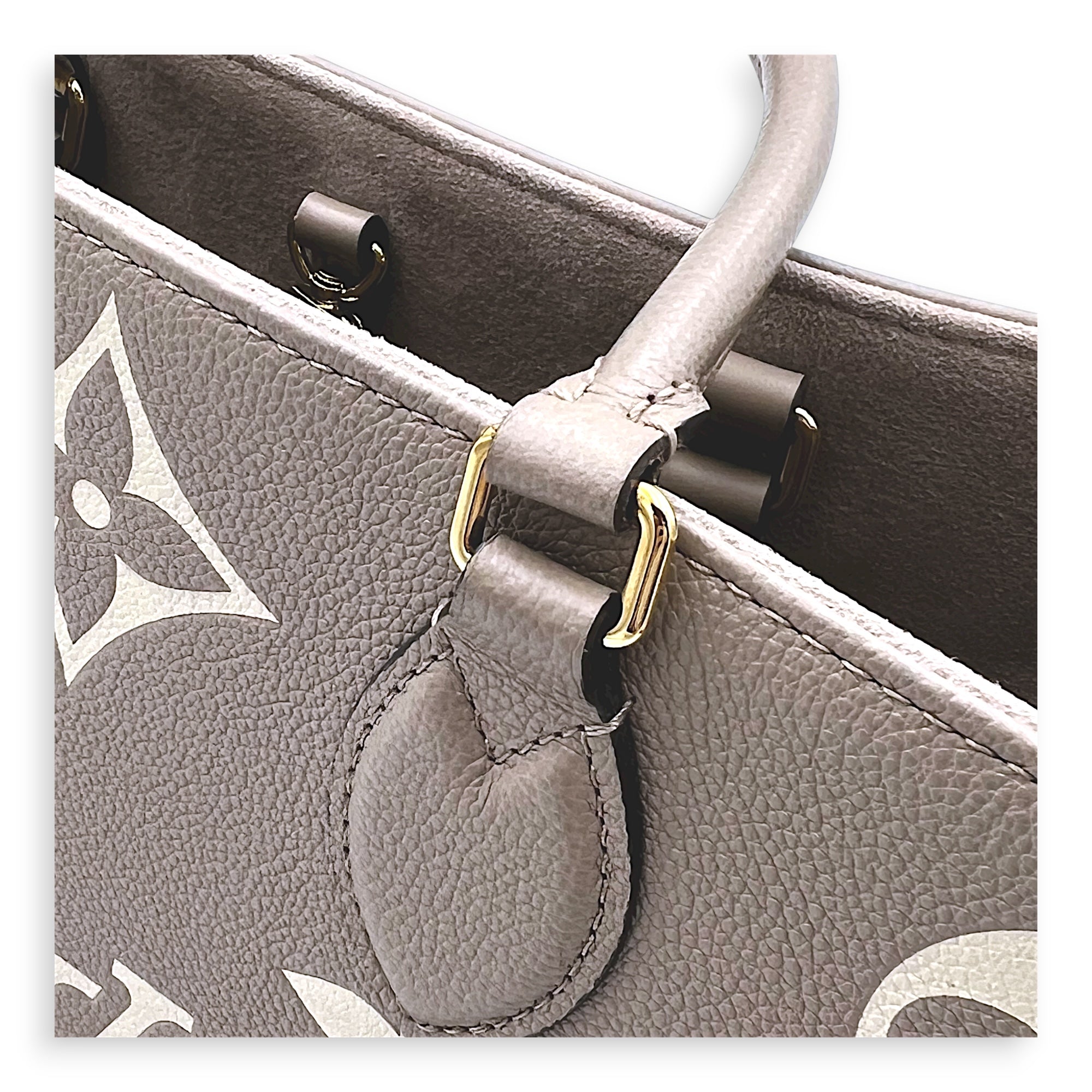 OnTheGo Top Handle Bag MM Beige in Empreinte Leather, Gold hardware