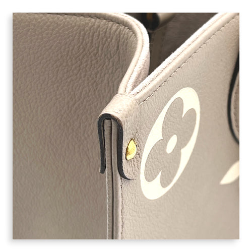OnTheGo Top Handle Bag MM Beige in Empreinte Leather, Gold hardware