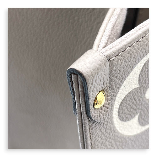 OnTheGo Top Handle Bag MM Beige in Empreinte Leather, Gold hardware
