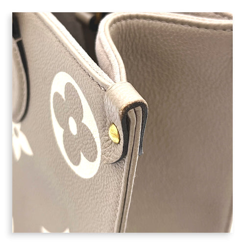 OnTheGo Top Handle Bag MM Beige in Monogram Empreinte Leather, Gold hardware