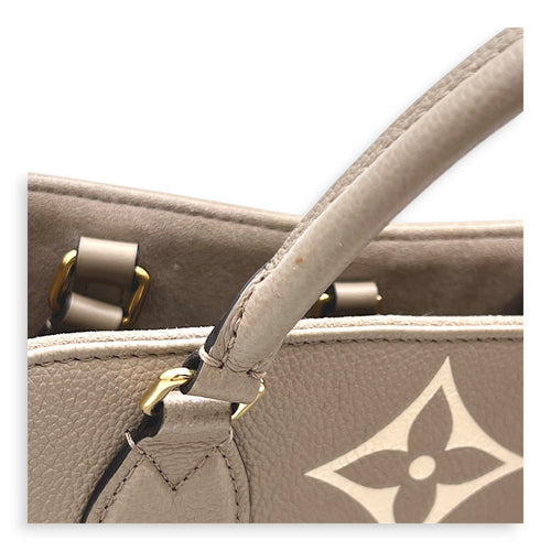 OnTheGo Top Handle Bag MM Beige in Monogram Empreinte Leather, Gold hardware
