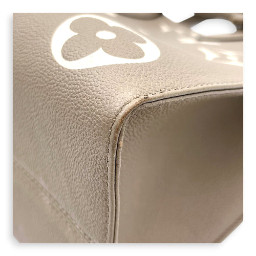 OnTheGo Top Handle Bag MM Beige in Monogram Empreinte Leather, Gold hardware