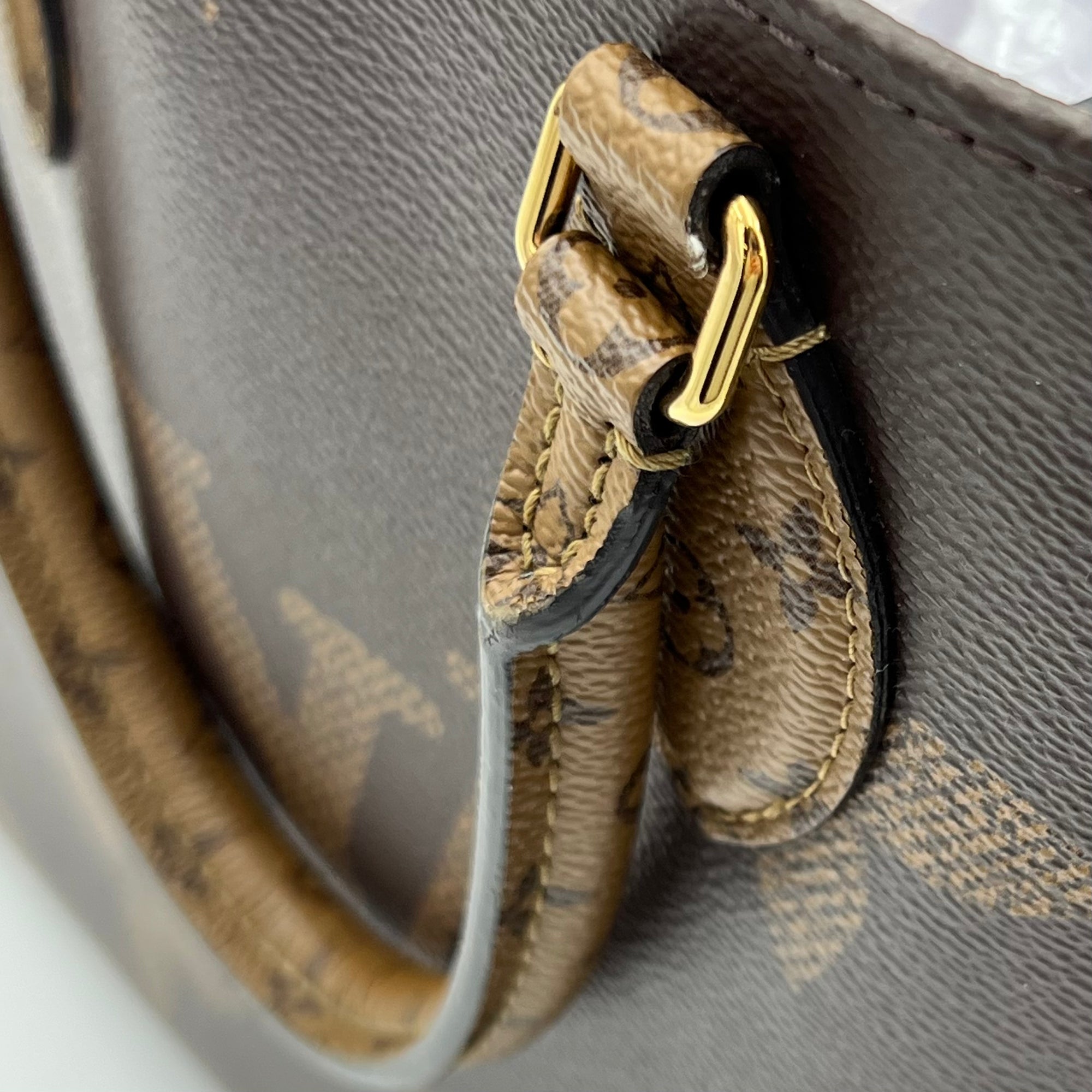 OnTheGo MM Brown Top Handle Bag in Monogram Coated Canvas, Gold hardware