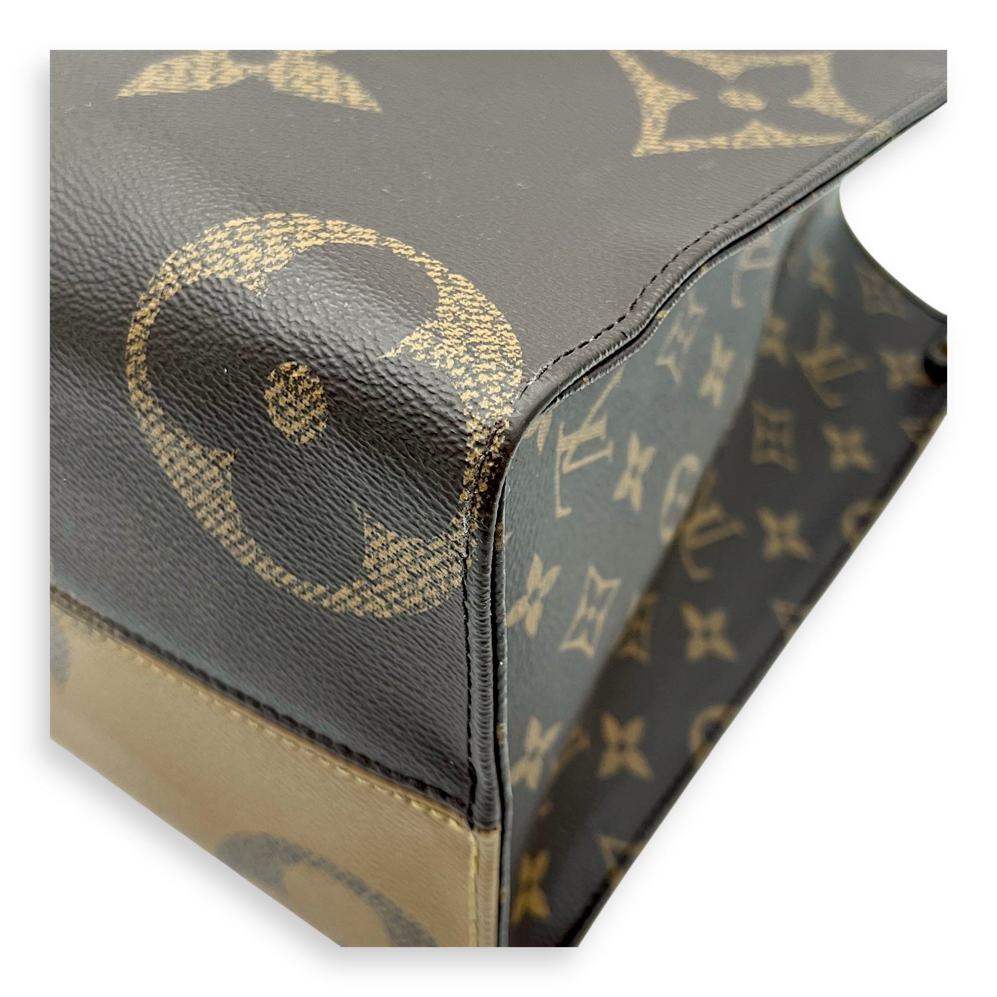 OnTheGo MM Brown Top Handle Bag in Monogram Coated Canvas, Gold hardware
