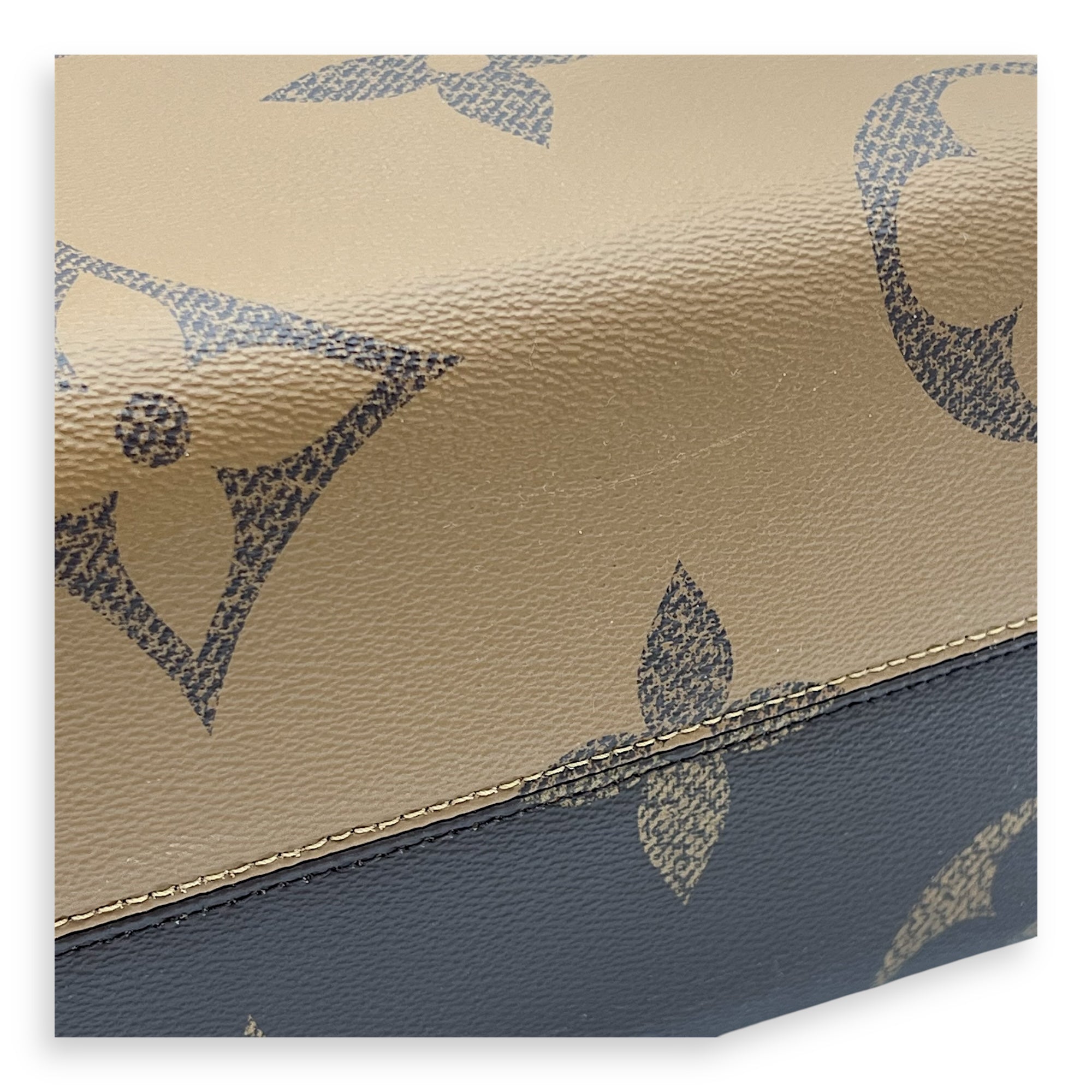 OnTheGo MM Brown Top Handle Bag in Monogram Coated Canvas, Gold hardware