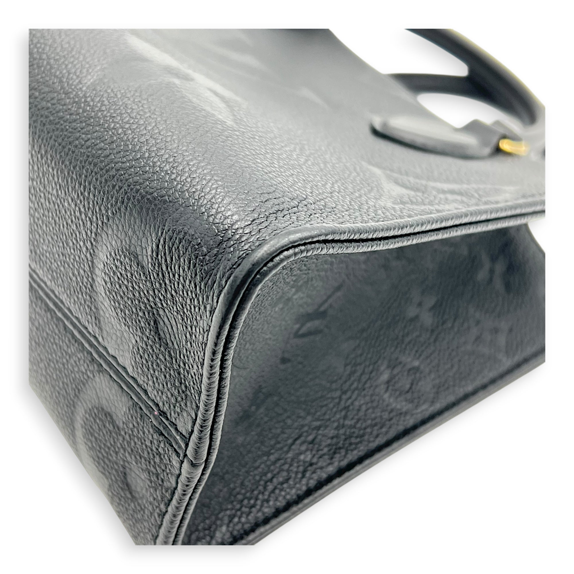 OnTheGo Top Handle Bag PM Black in Empreinte Leather, Gold hardware