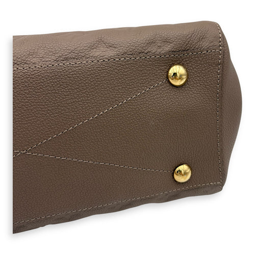 Montaigne Top Handle Bag MM Beige in Empreinte Leather, Gold hardware