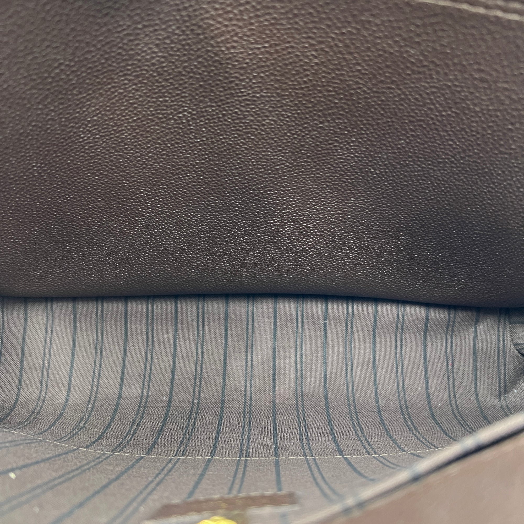 Montaigne Top Handle Bag GM Brown in Empreinte Leather, Gold hardware