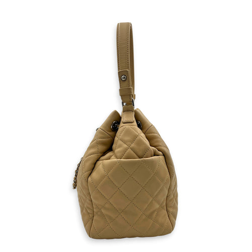 Drawstring CC Beige Bucket Bag in Lambskin, Silver hardware