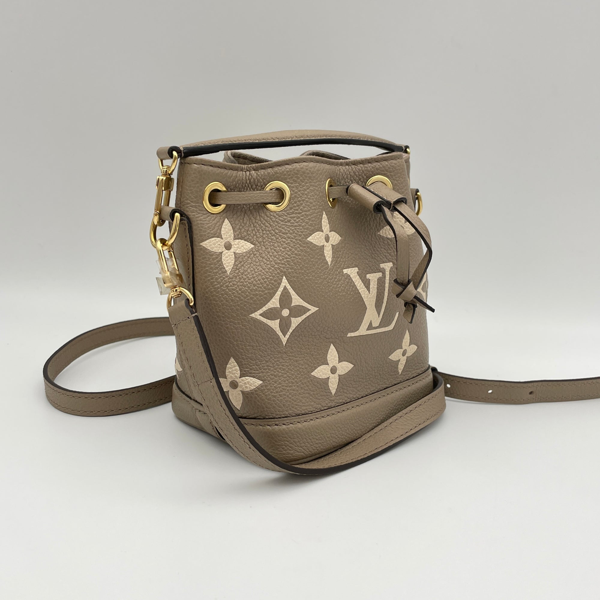 Noe Nano Beige Bucket Bag in Monogram Empreinte Leather, Gold hardware