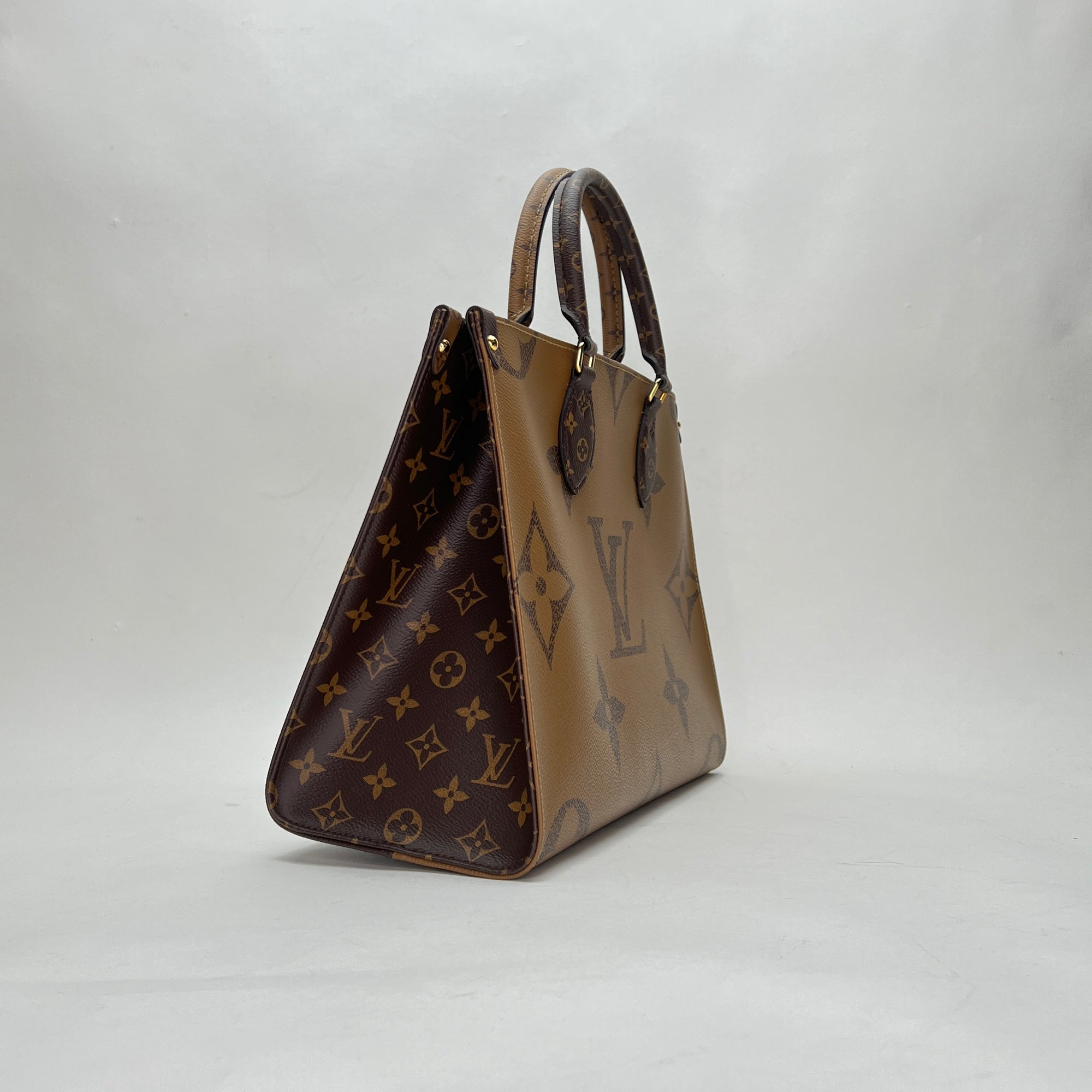 OnTheGo MM Brown Top Handle Bag in Monogram Coated Canvas, Gold hardware