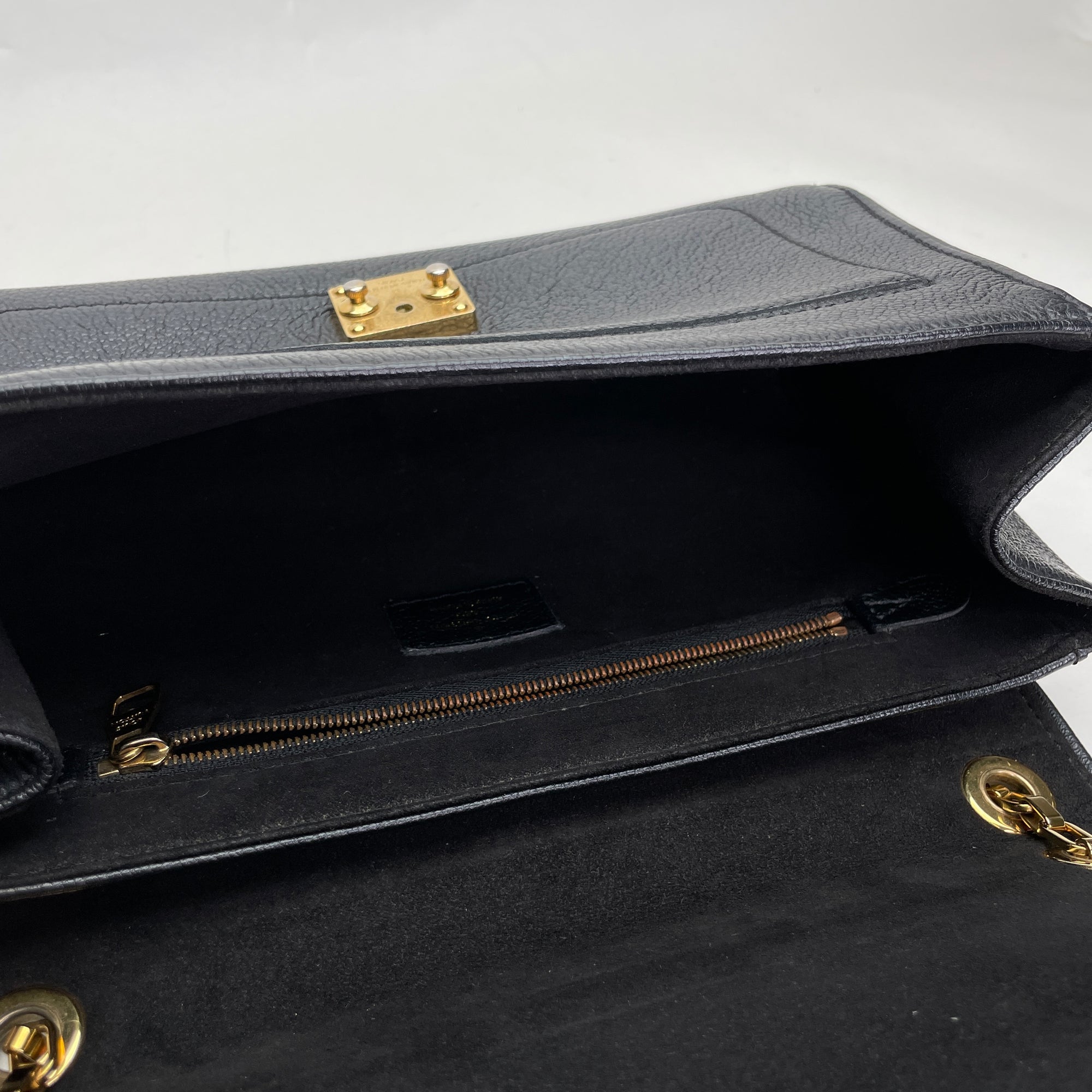 Saint Germain PM Black Shoulder Bag in Monogram Empreinte Leather, Gold hardware