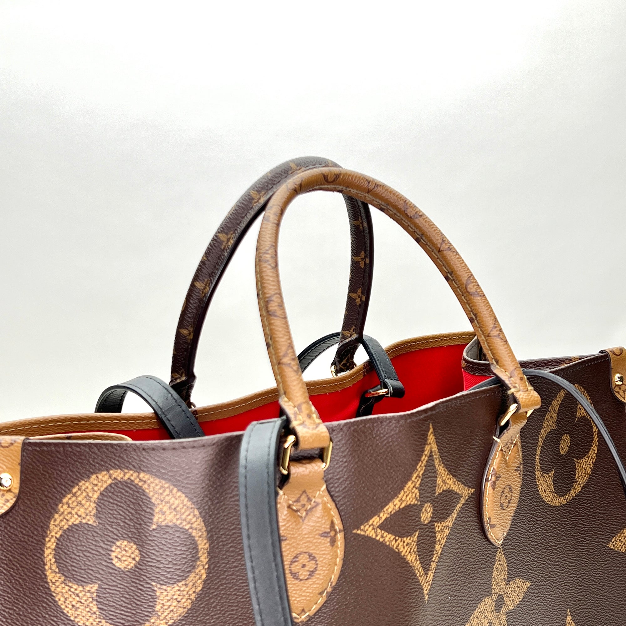 OnTheGo GM Brown Top Handle Bag in Monogram Coated Canvas, Gold hardware