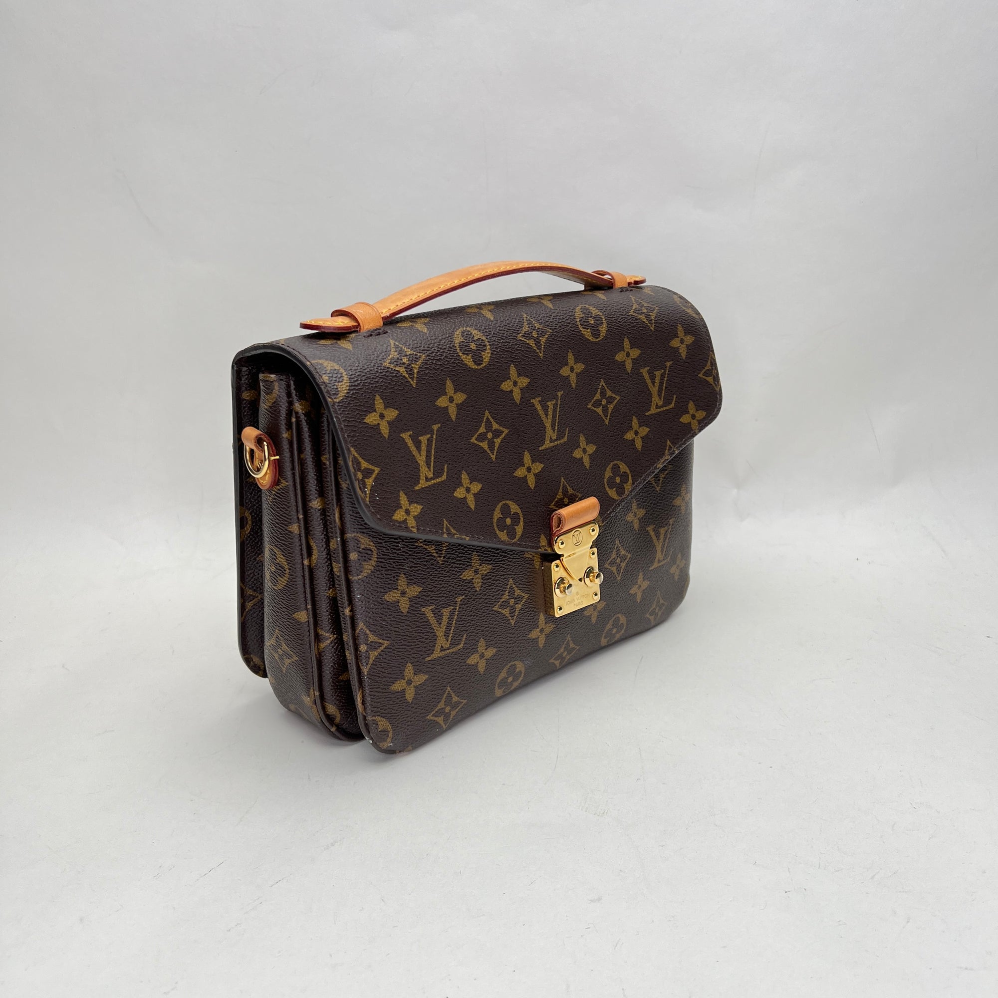 Metis Pochette Brown Crossbody Bag in Monogram Coated Canvas, Gold hardware