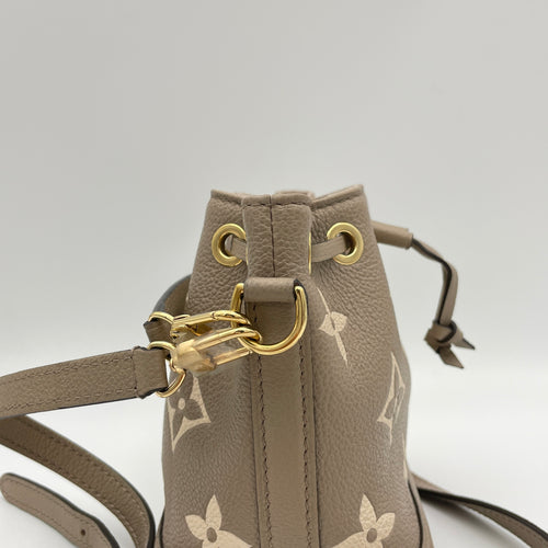 Noe Nano Beige Bucket Bag in Monogram Empreinte Leather, Gold hardware