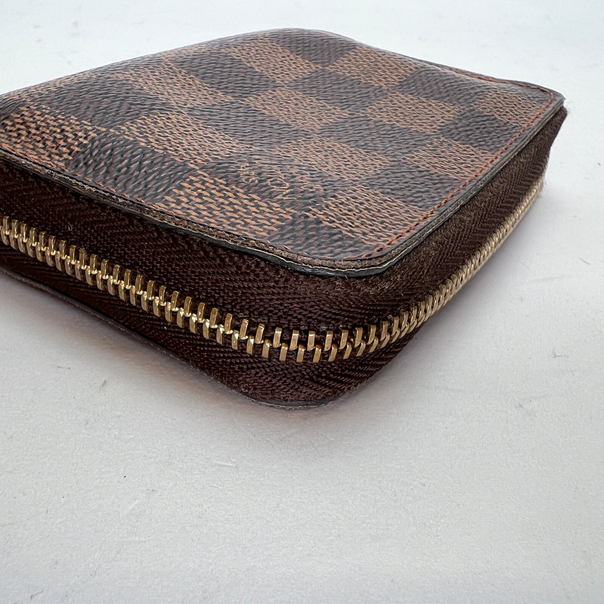 Damier Ebene Zip Brown Wallet in Coated Canvas, Gold hardware