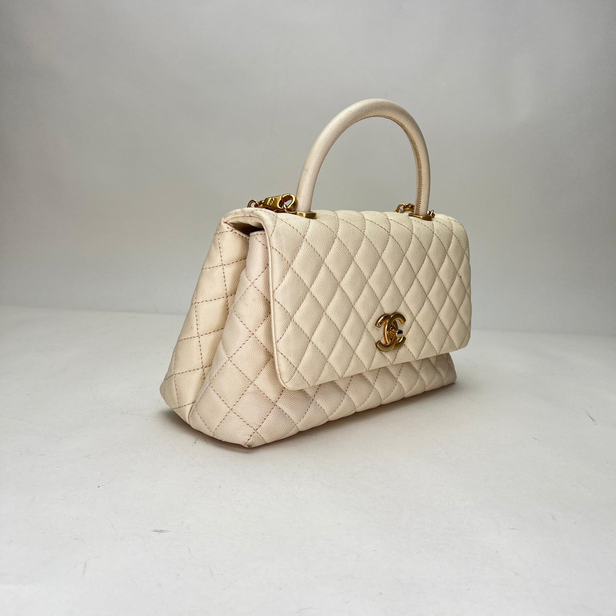 Coco Medium Beige Top Handle Bag in Caviar Leather, Gold hardware