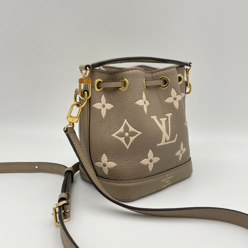 Noe Nano Beige Bucket Bag in Monogram Empreinte Leather, Gold hardware