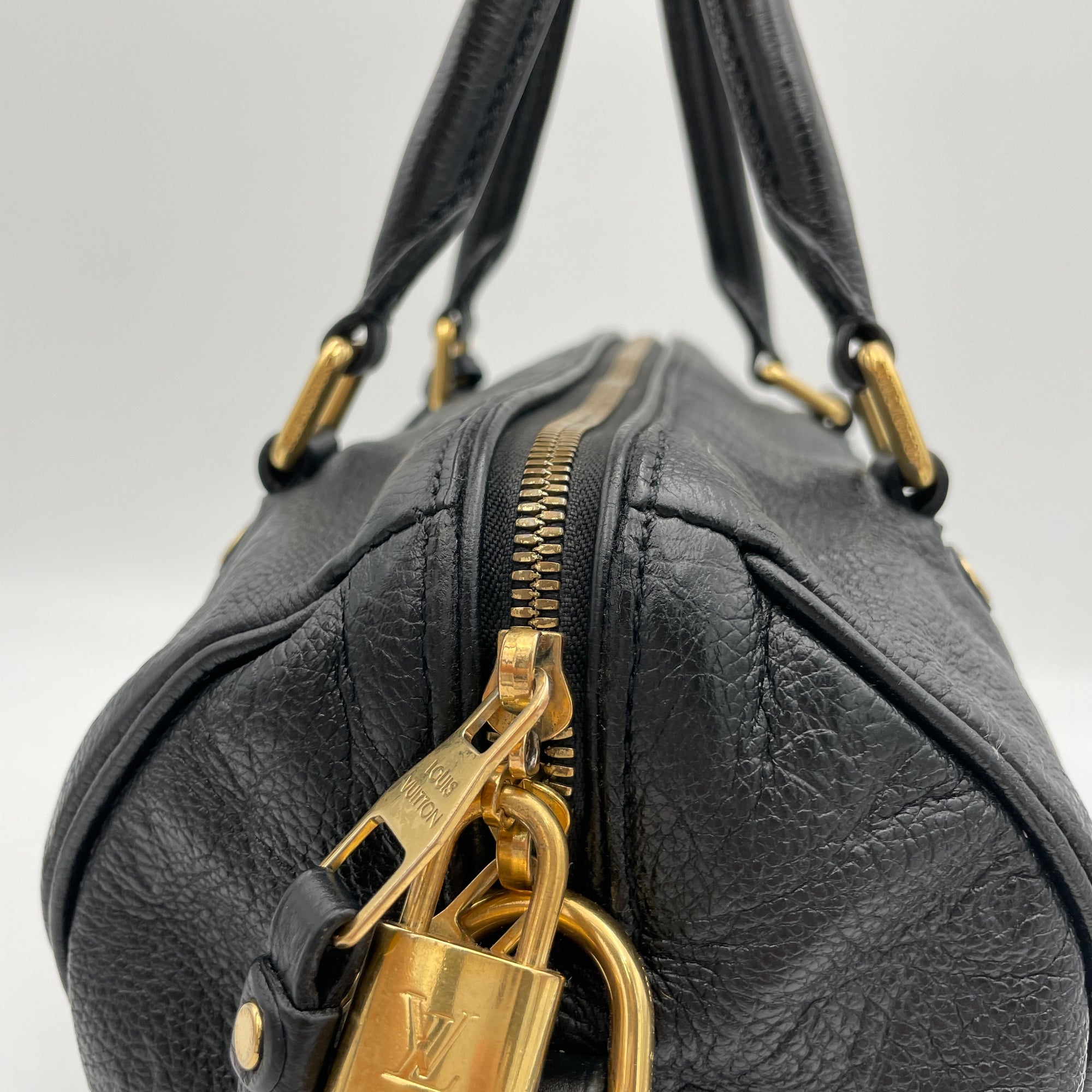 Speedy 25 Black Top Handle Bag in Monogram Empreinte Leather, Gold hardware