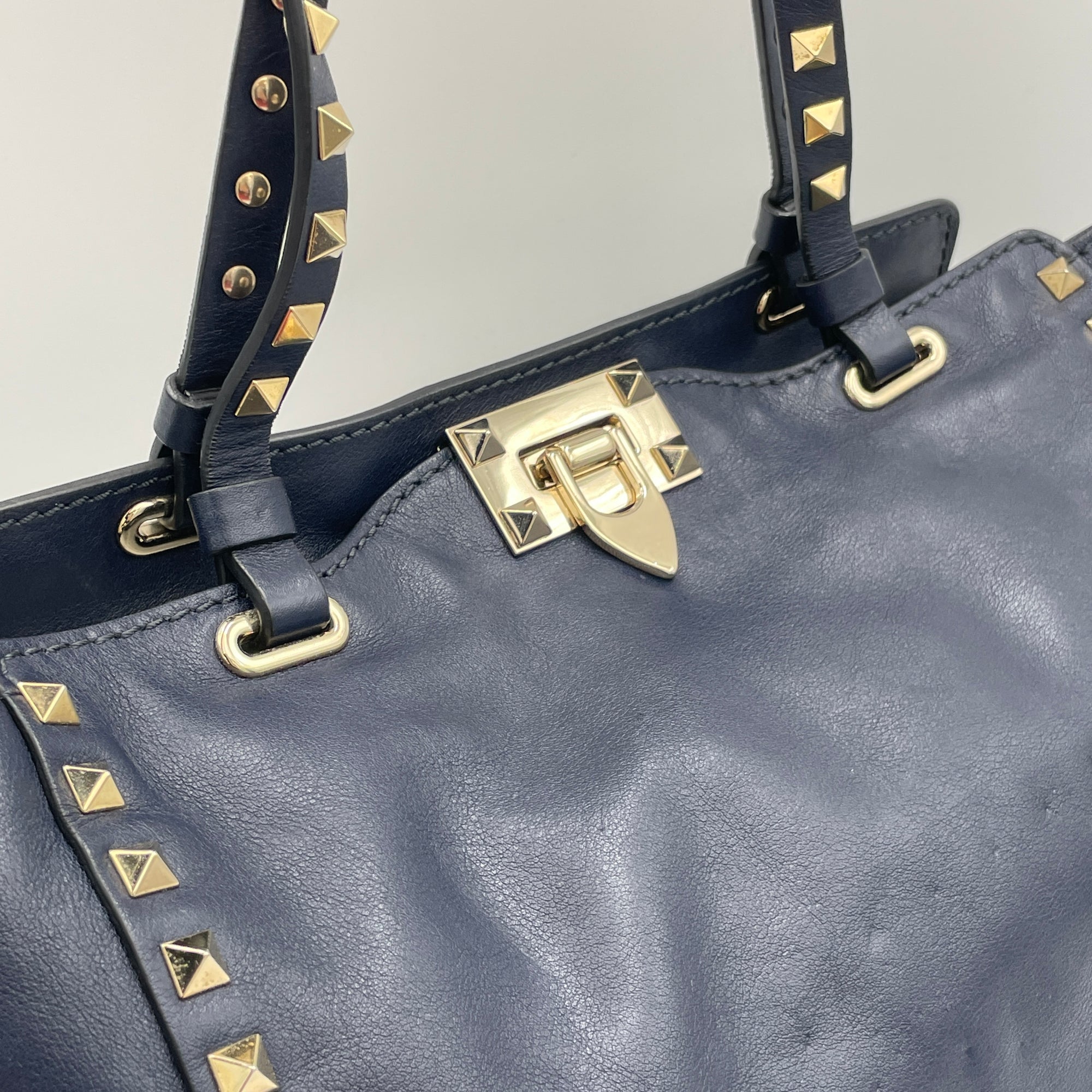 Rockstud Navy Top Handle Bag in Calfskin, Gold hardware