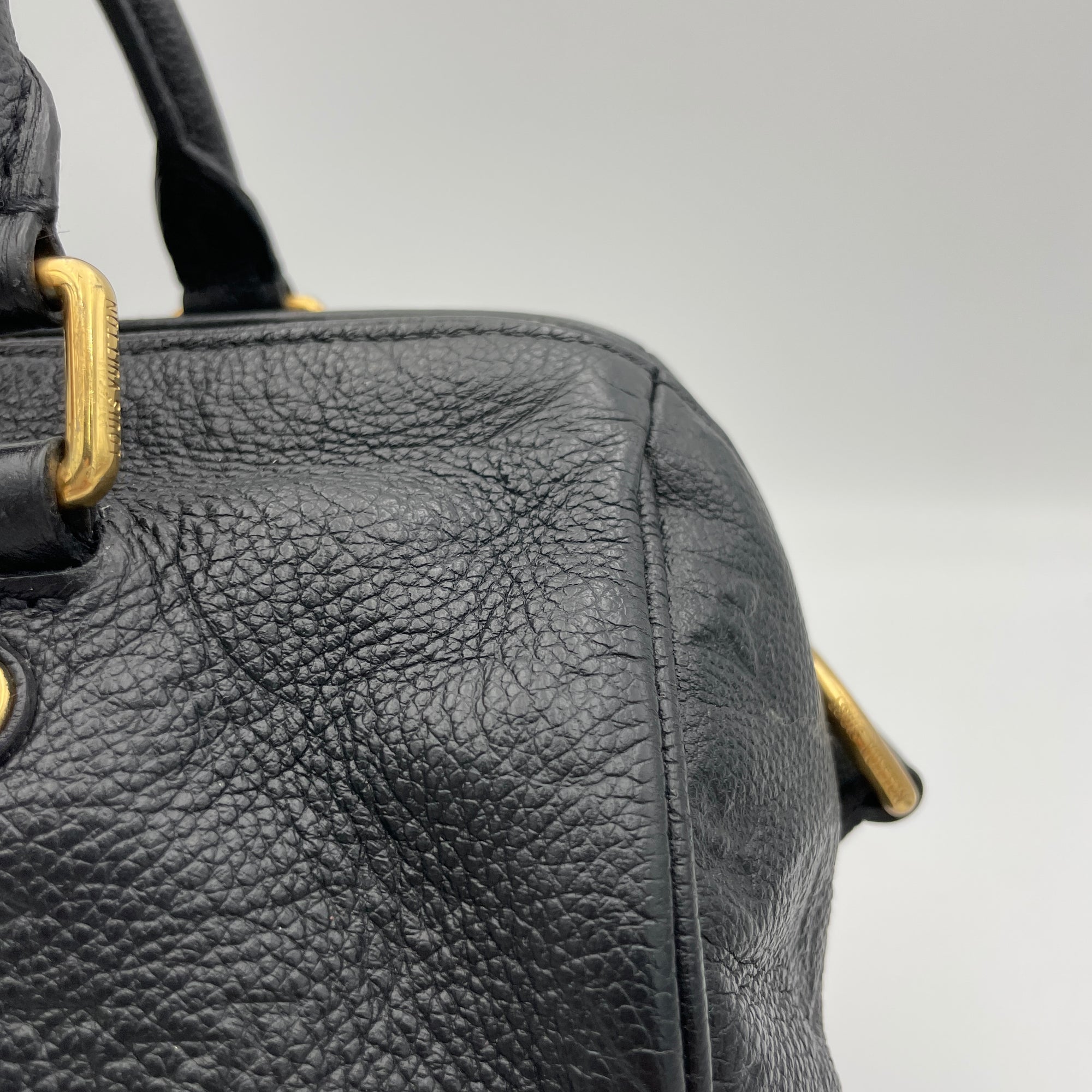 Speedy 25 Black Top Handle Bag in Monogram Empreinte Leather, Gold hardware