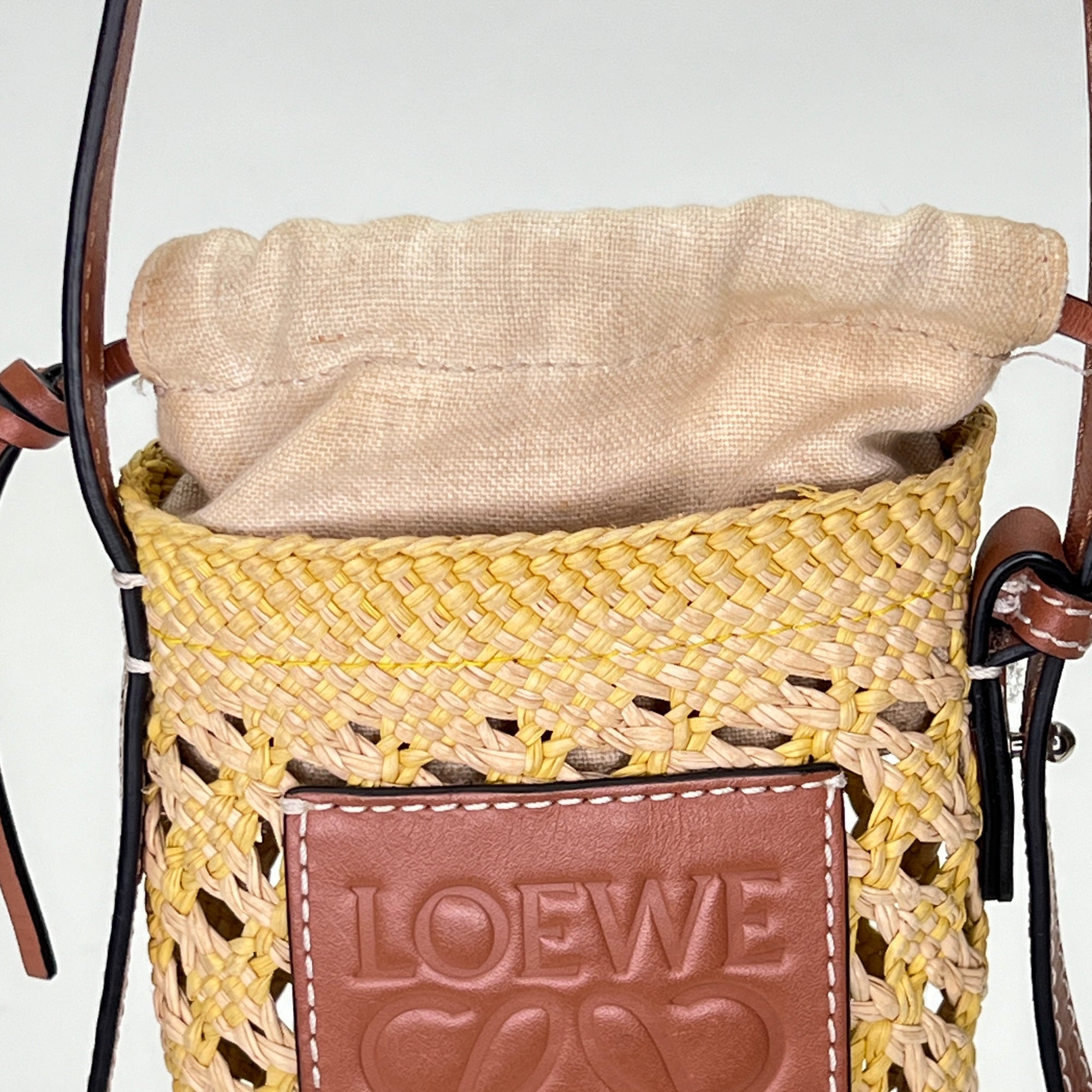 Cylinder Pouch Brown Crossbody Bag in Raffia