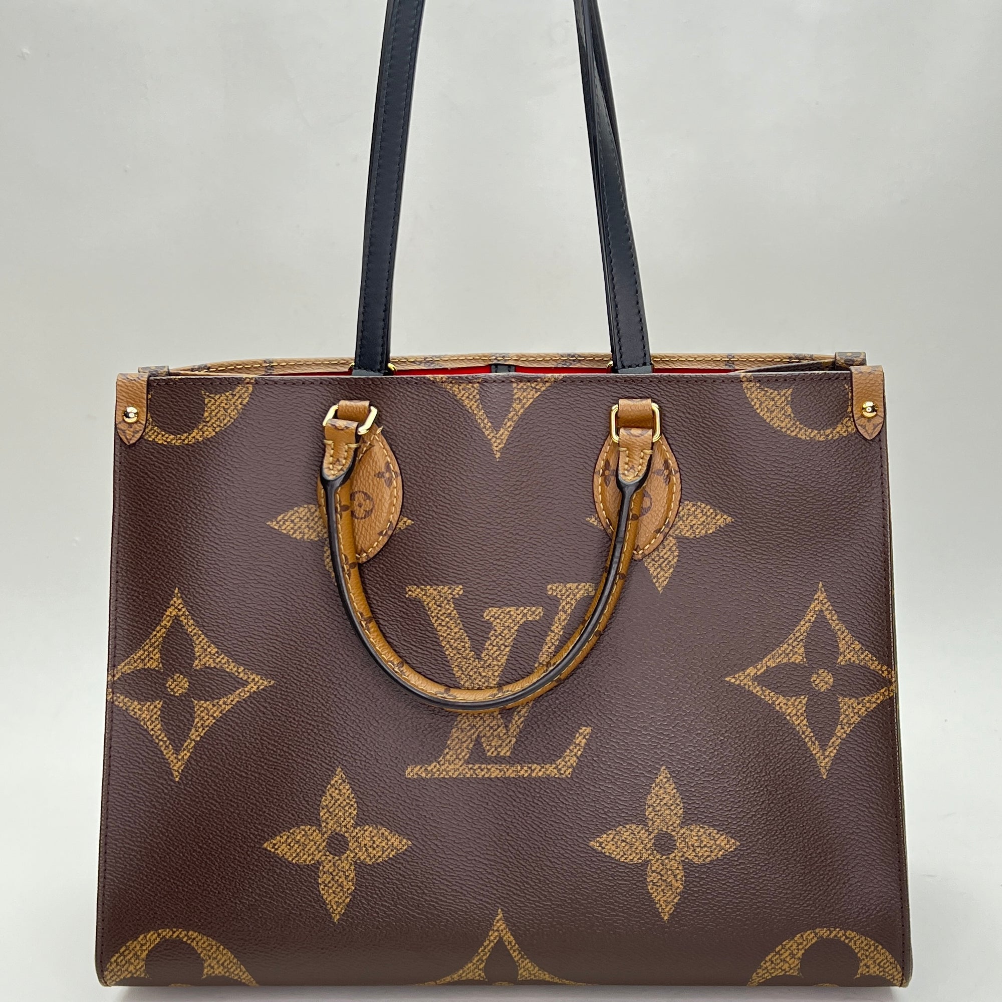 OnTheGo MM Brown Top Handle Bag in Monogram Coated Canvas, Gold hardware