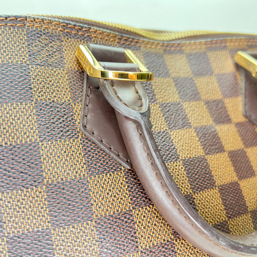 Damier Ebene Alma PM Brown Top Handle Bag in Coated Canvas, Gold hardware