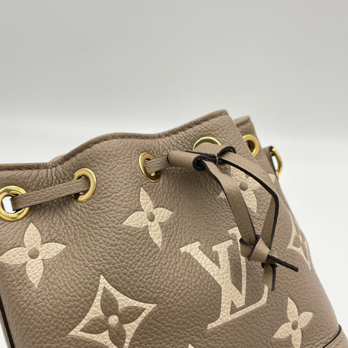 Noe Nano Beige Bucket Bag in Monogram Empreinte Leather, Gold hardware