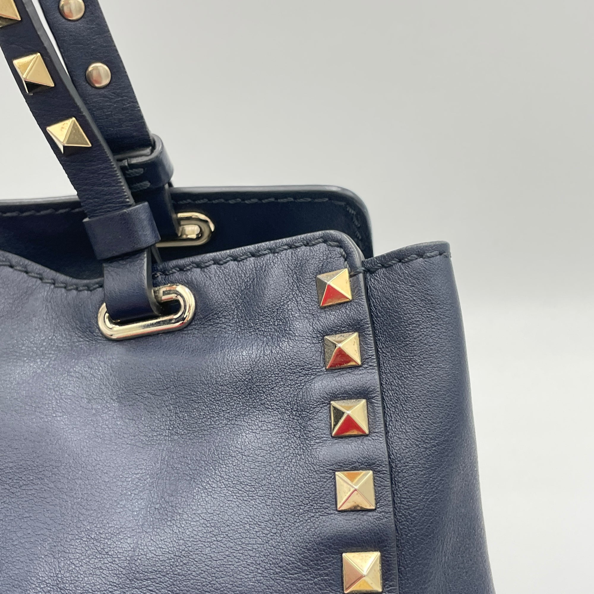 Rockstud Navy Top Handle Bag in Calfskin, Gold hardware